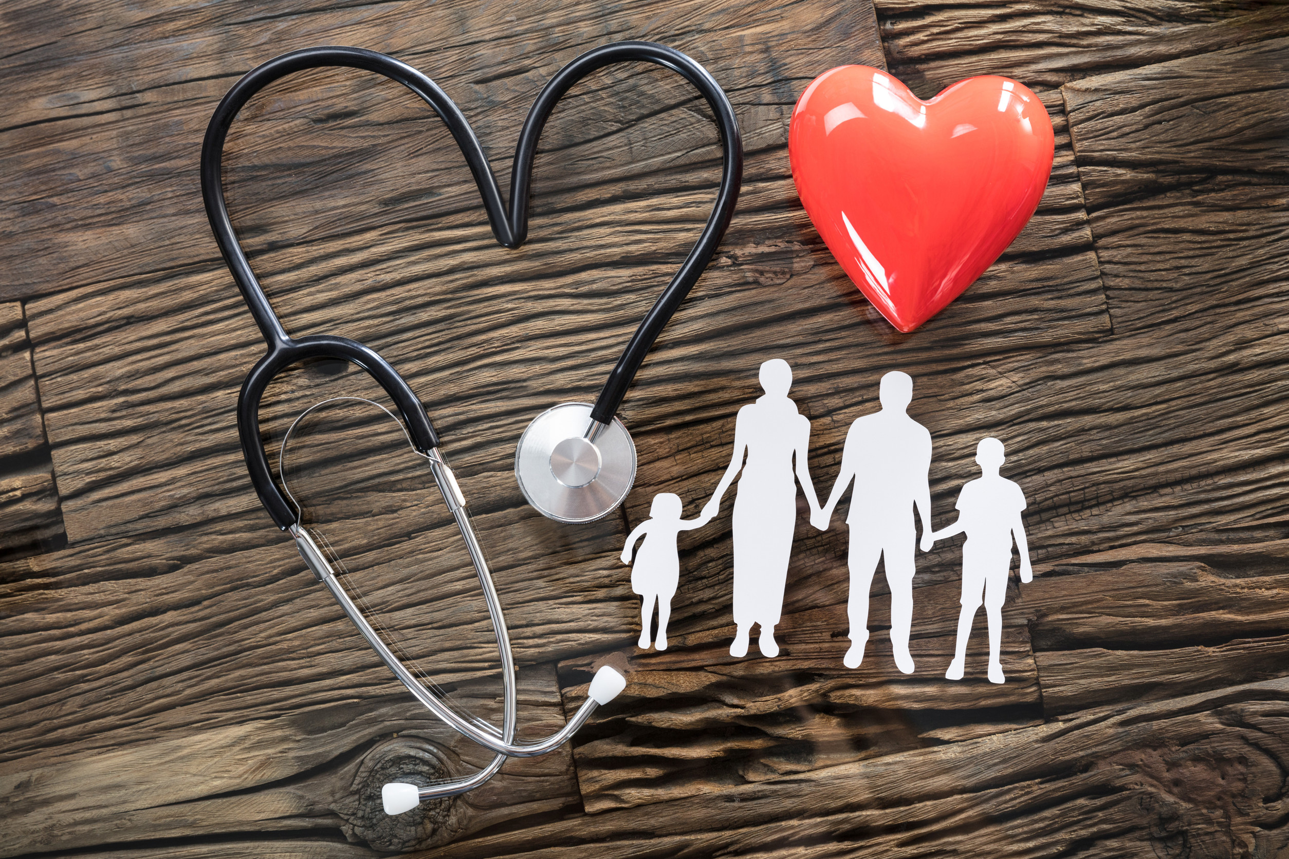Family Cut Out And Red Heart On Desk